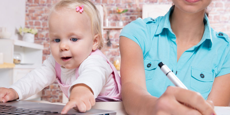Mother working flexibly with child