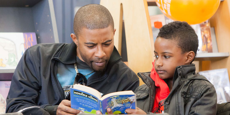 Father reading with son