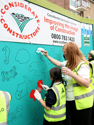 Children painting Considerate Constructors Scheme hoarding