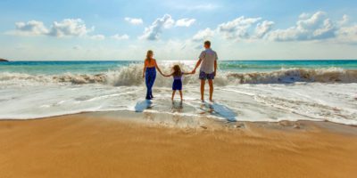 Parents with daughter on beach