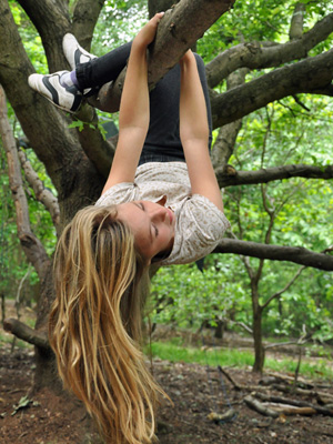 Girl-climbing-tree at Forest School