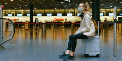 Woman at airport with mask on