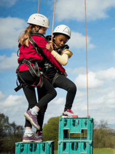 Cubs taking part in a crate stacking exercise