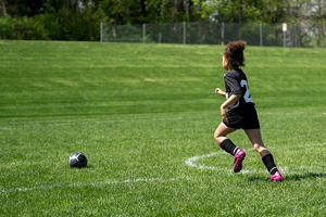 girl-playing-football